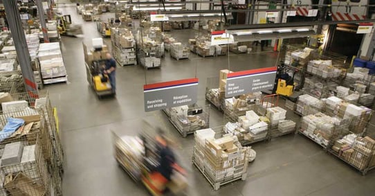 Warehouse manager checking her inventory in a large warehouse-1