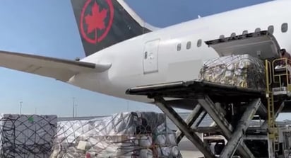 air cargo being loaded on passenger plane