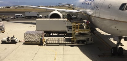 air freight being loaded on plane