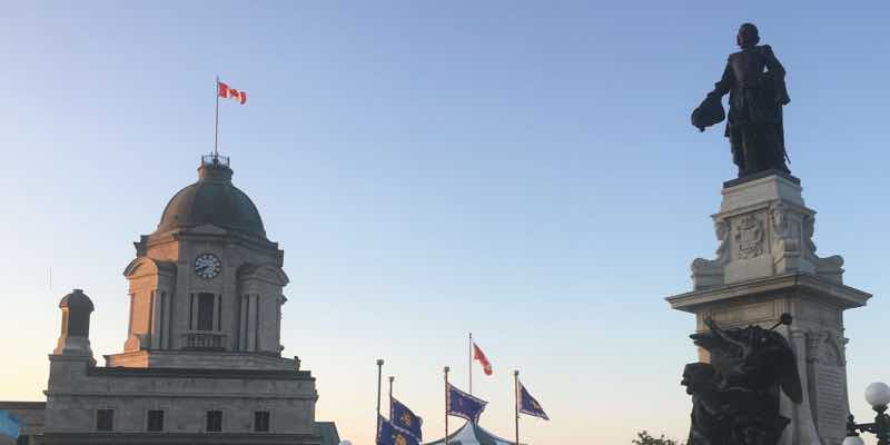 quebec city building tops with flags