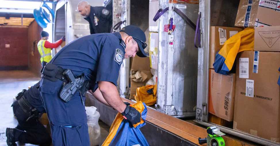 customs service inspecting packages