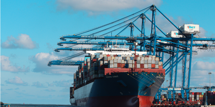 container ship at port being loaded