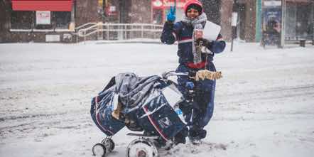 USPS worker deliver in Snow